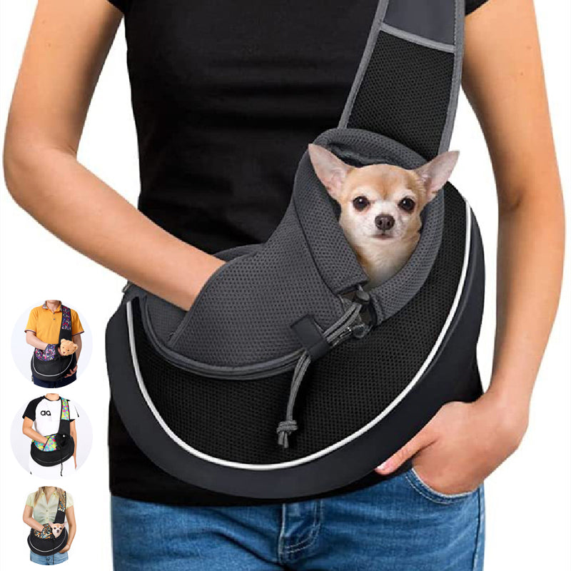 Small dog riding in a black breathable crossbody pet sling carrier