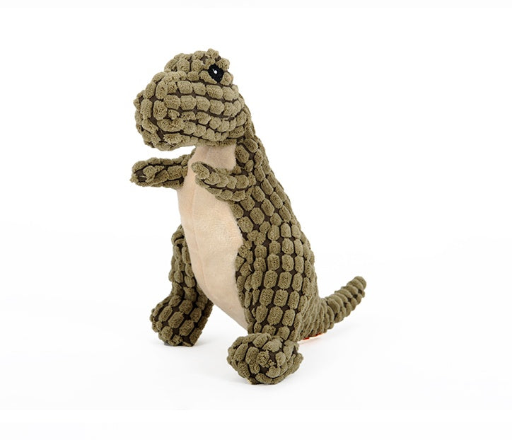 Green corduroy dinosaur plush dog toy standing on a white background