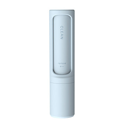 Hand holding the pet hair remover brush, showing the collection chamber