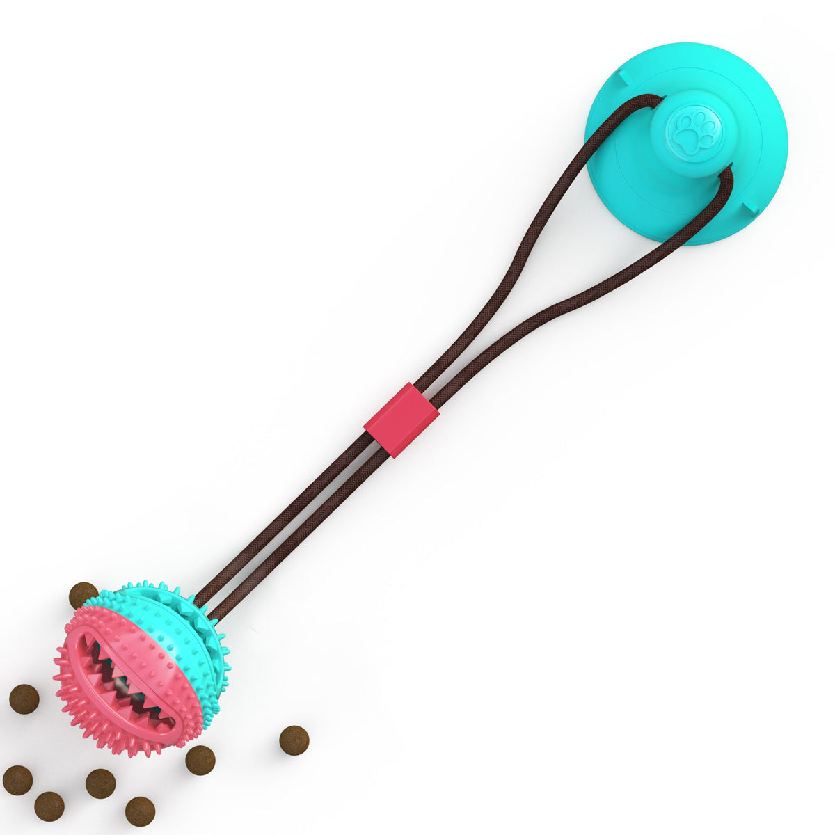Suction cup tug toy with rope and textured ball beside scattered kibble